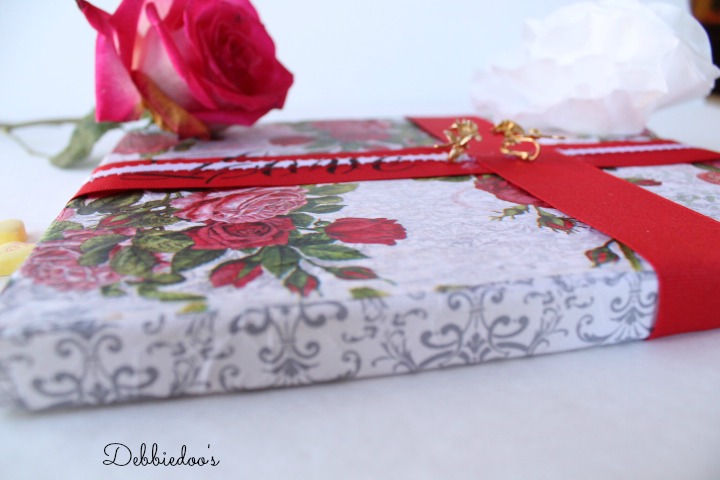 Mod podge tissue paper on canvas