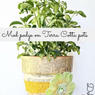 Mod podge terra cotta pots with fabric and a vintage recipe book 006